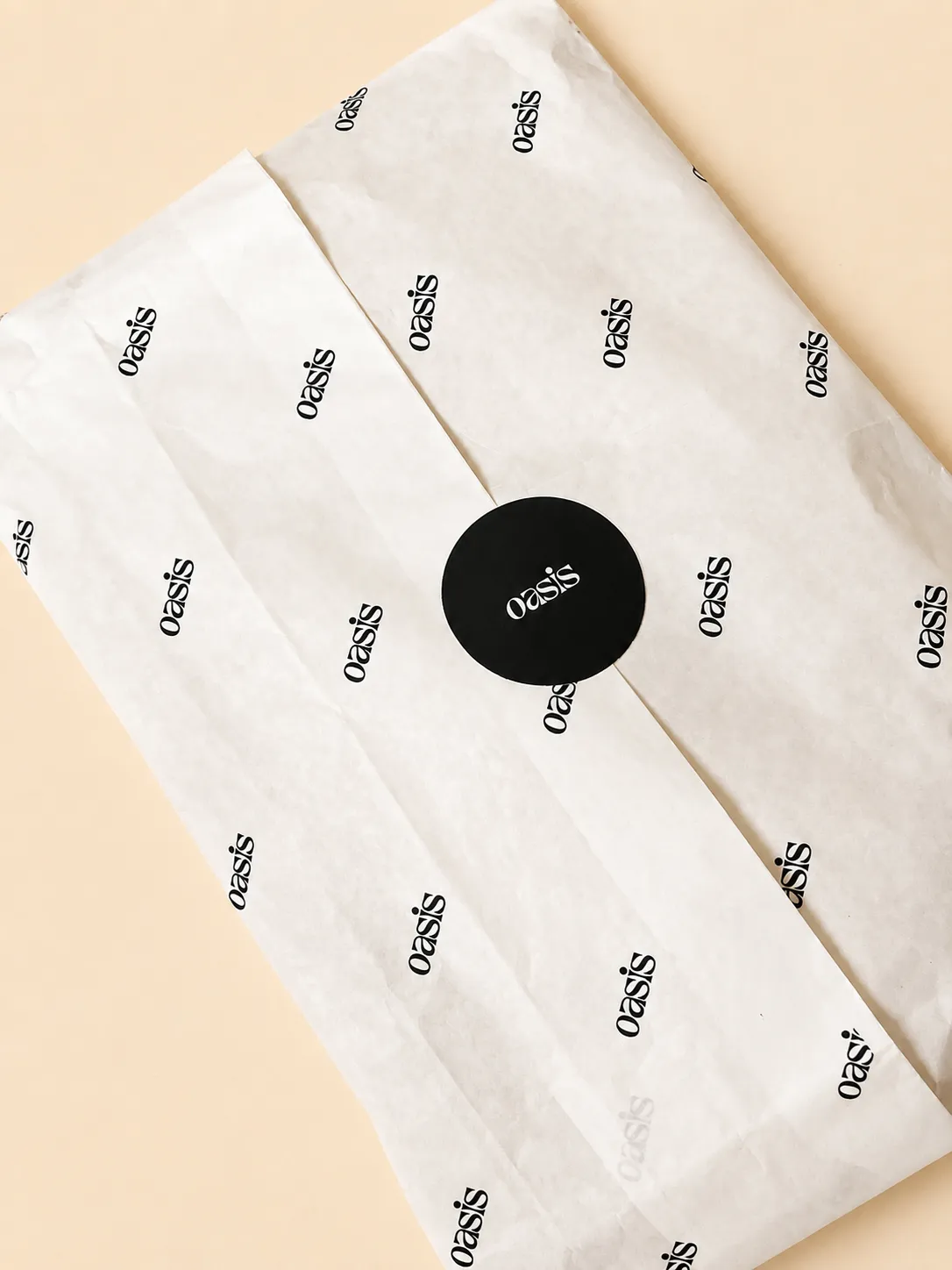 Branded tissue paper finished with a custom sticker seal