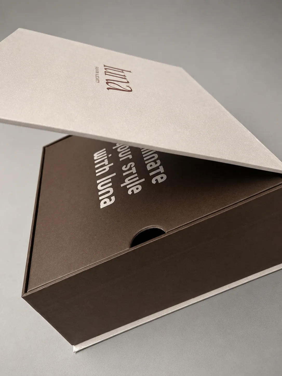 Tray-in-bed rigid box wrapped in premium speciality paper with attached inner tray